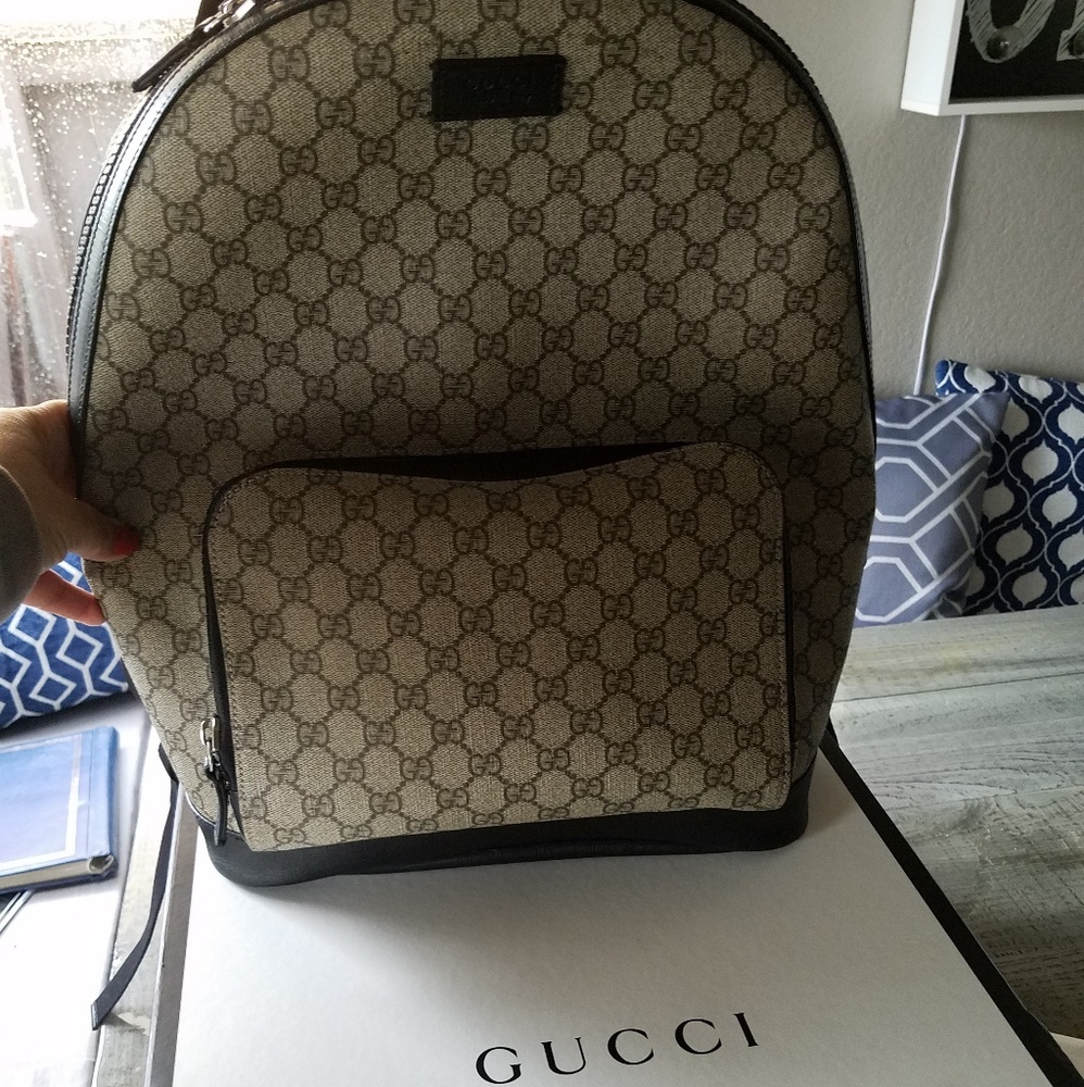 Gucci backpack with papers